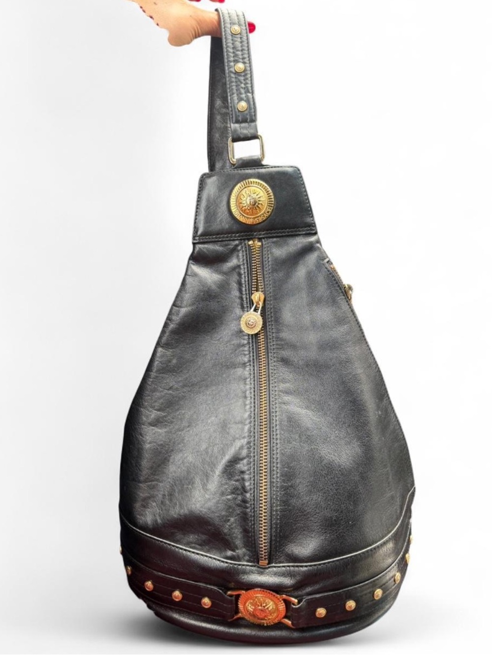 Vintage Gianni Versace leather backpack with gold colored accents
